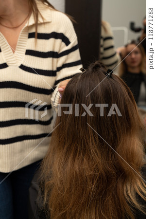 Hairdresser works with the client's hair. Workflow in a beauty salon. Barbershop Hairdresser works with the client's hair. Workflow in a beauty salon. Barbershop 118771288