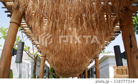 Traditional esthetic shade cover gazebo made with dry straw authentic decoration. 118777314