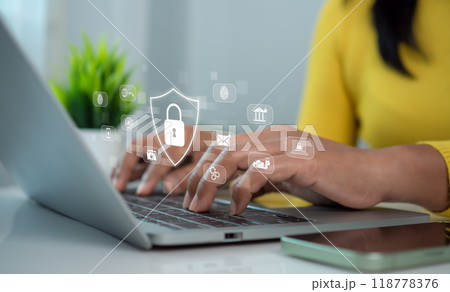 Cybersecurity and Global network security technology concept, Businesswoman protecting personal data on computer with virtual interface, Internet secure technology, Cyber security. 118778376