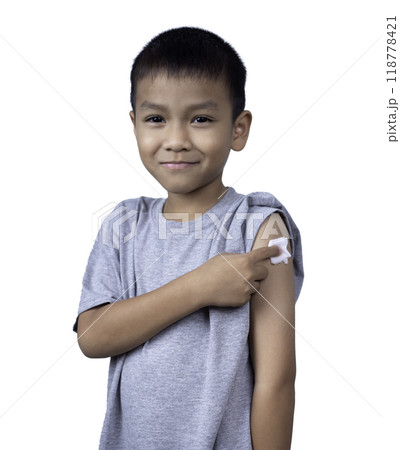 Little asian child boy wearing short-sleeve shirt with bandage plaster on her arm after vaccination for boost immunity. Injection covid vaccine, Tetanus vaccine, Flu vaccine, healthcare for children. Little asian child boy wearing short-sleeve shirt with bandage plaster on her arm after vaccination for boost immunity. Injection covid vaccine, Tetanus vaccine, Flu vaccine, healthcare for children. 118778421