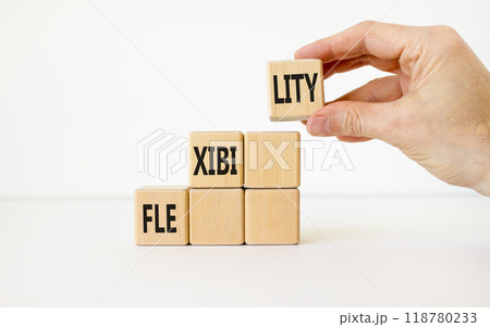 Flexibility symbol. Concept word Flexibility on beautiful wooden cubes. Businessman hand. Beautiful white background. Business flexibility concept. Copy space. Flexibility symbol. Concept word Flexibility on beautiful wooden cubes. Businessman hand. Beautiful white background. Business flexibility concept. Copy space. 118780233
