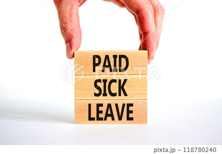 Paid sick leave symbol. Concept words Paid sick leave on wooden blocks. Doctor hand. Beautiful white table white background. Business medical and paid sick leave concept. Copy space. Paid sick leave symbol. Concept words Paid sick leave on wooden blocks. Doctor hand. Beautiful white table white background. Business medical and paid sick leave concept. Copy space. 118780240