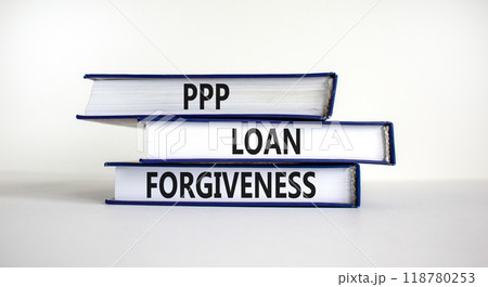 PPP, paycheck protection program loan forgiveness. Concept words PPP loan forgiveness on books on white background. Business, PPP - paycheck protection program loan forgiveness concept. 118780253