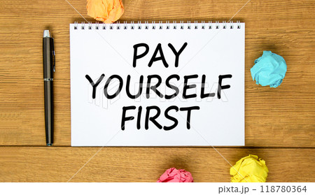 Pay yourself first symbol. Concept words Pay yourself first on beautiful white note. Beautiful wooden background. Black pen. Colored paper. Business and pay yourself first concept. Copy space. 118780364