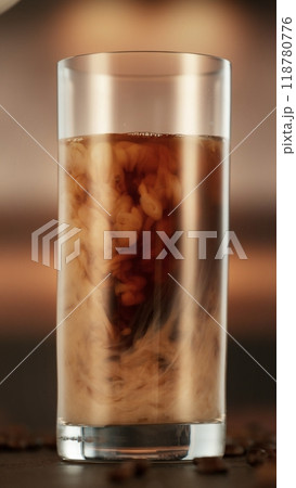 Mixing Milk in Coffee Drink in Detail. Mixing Milk in Coffee Drink in Detail. 118780776