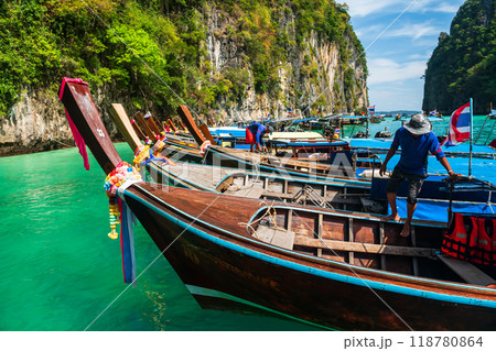 Wood boats and sailors at Loh Samah Bay of Pileh, Phi Phi island, Krabi Wood boats and sailors at Loh Samah Bay of Pileh, Phi Phi island, Krabi 118780864