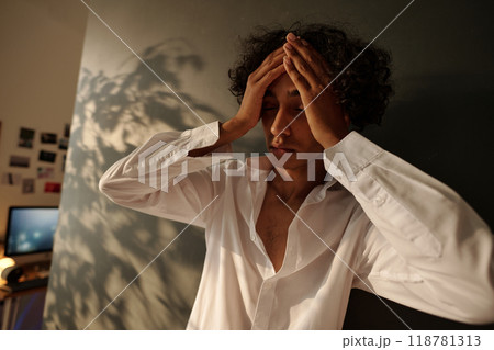 Man with hangover symptoms after booze Man with hangover symptoms after booze 118781313