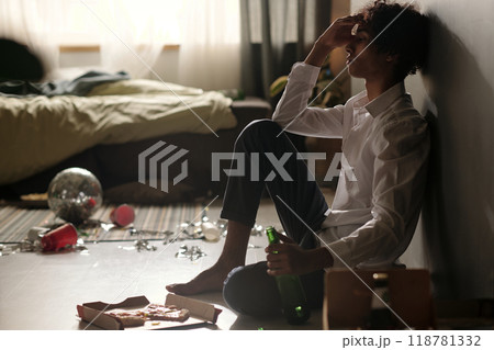 Man feeling unwell and touching his head 118781332