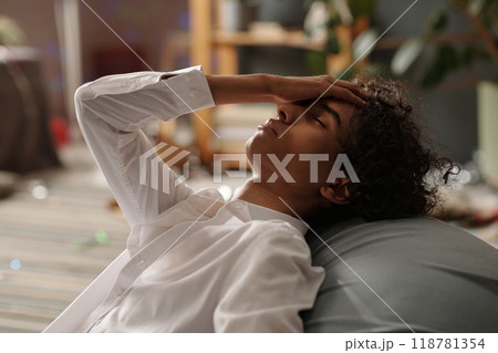 Sick guy with symptoms of hangover 118781354