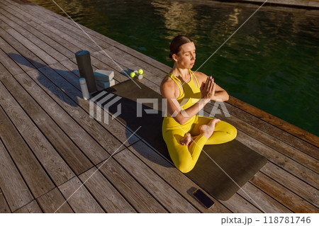 Engaging in Yoga Practice by the Water Experience True Serenity in Motion for Mindfulness 118781746