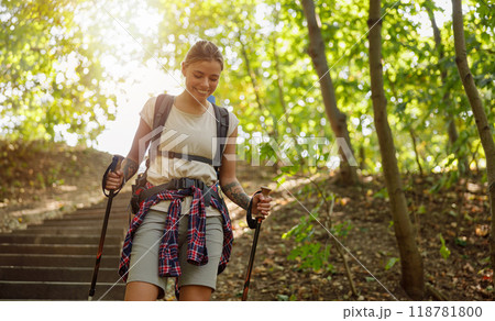 A Happy Hiker is Enjoying the Beauty of Nature on a Scenic Trail in the Great Outdoors A Happy Hiker is Enjoying the Beauty of Nature on a Scenic Trail in the Great Outdoors 118781800