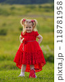 little girl in a red dress 118781958