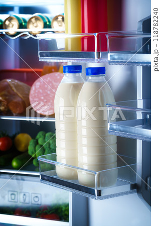 Bottles of milk in the fridge Bottles of milk in the fridge 118782240