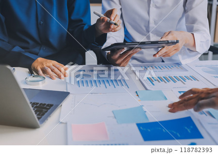 Fund managers team consultation and discuss about analysis Investment stock market at office 118782393