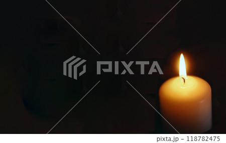 lit candle with black background 118782475