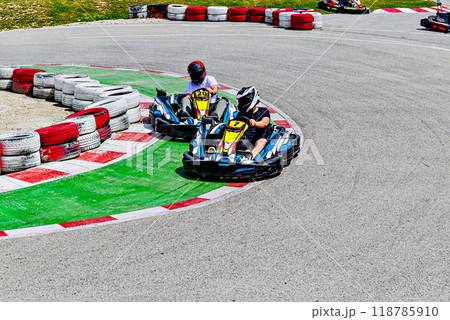 Young racers competing with karts on a Karting circuit in Barcelona. Lifestyle	 118785910