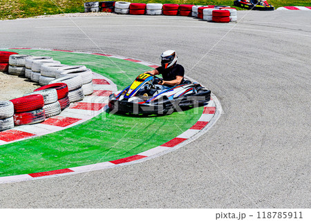 Young racers competing with karts on a Karting circuit in Barcelona. Lifestyle	 118785911
