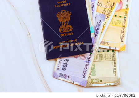 Republic of India passport on Indian rupees of various denominations is accompanied by a currency banknotes Republic of India passport on Indian rupees of various denominations is accompanied by a currency banknotes 118786092