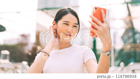 Young adult asian business single woman using smartphone for online dating app at outdoor Young adult asian business single woman using smartphone for online dating app at outdoor 118786938