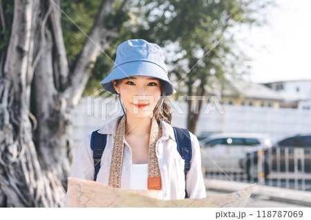 Young adult asian traveller woman travel in city using maps at Bangkok Thailand 118787069