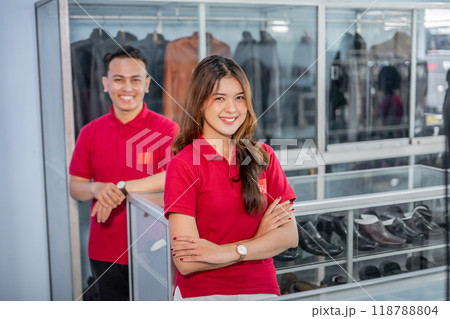 male and female employee working at leather shoes store 118788804