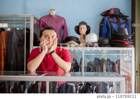 leather shoe businessman thinking and waiting customer with hands on cheek leather shoe businessman thinking and waiting customer with hands on cheek 118789211