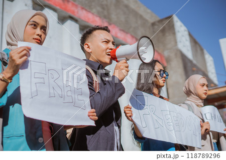 A Diverse Group of Young Activists Protests with Passion for Freedom and Change A Diverse Group of Young Activists Protests with Passion for Freedom and Change 118789296