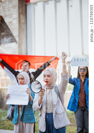 Activists gather to promote change using megaphones and vibrant banners 118789305