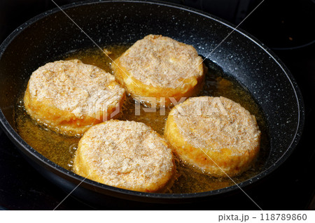 Frying breaded cheese 118789860