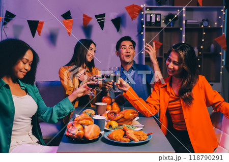 Joyful office Halloween party with coworkers in costumes, celebrating with drinks and laughter, fostering teamwork and festive spirit 118790291