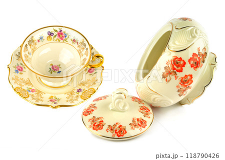 Vintage porcelain tableware: coffee cup with saucer and elegant candy bowl isolated on white. Collage. 118790426