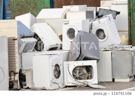 Pile of discarded household appliances for e-waste disposal 118791106
