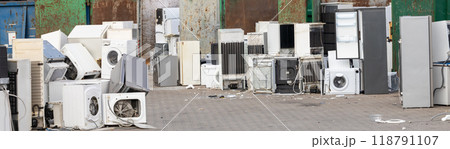 Discarded appliances in an e-waste disposal area Discarded appliances in an e-waste disposal area 118791107