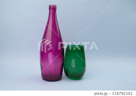 Colorful glass bottle and empty glass background 118792101