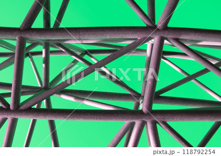 Abstract metal figure on a colorful pink background, artistically welded metal pipes, fragment of scaffolding in NYC Abstract metal figure on a colorful pink background, artistically welded metal pipes, fragment of scaffolding in NYC 118792254