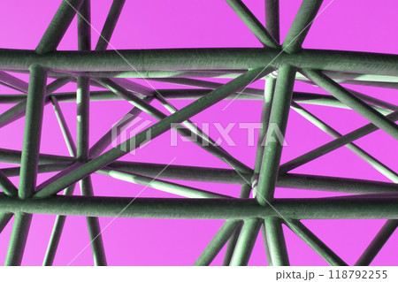 Abstract metal figure on a colorful pink background, artistically welded metal pipes, fragment of scaffolding in NYC Abstract metal figure on a colorful pink background, artistically welded metal pipes, fragment of scaffolding in NYC 118792255