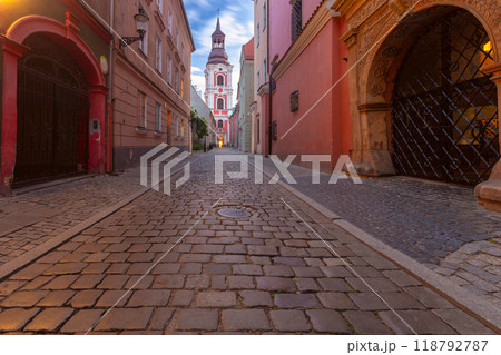 Cobbled Street Leading to Church at Sunset in Poznan, Poland Cobbled Street Leading to Church at Sunset in Poznan, Poland 118792787
