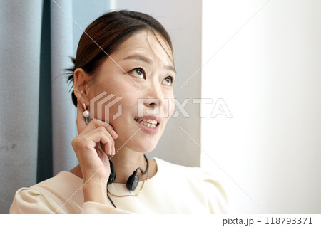 30s business woman posing as a business woman in studio 118793371