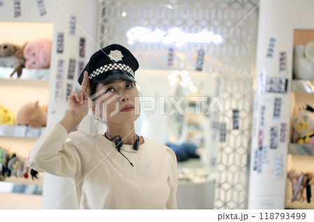 30s business woman posing as a business woman in studio 118793499