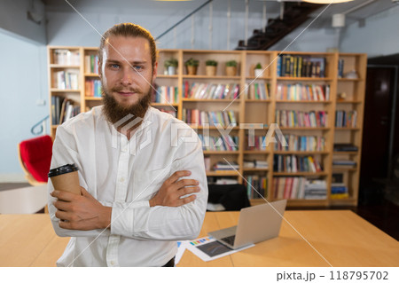 Charming handsome businessman with beard holding suit drink coffee cup smiling Charming handsome businessman with beard holding suit drink coffee cup smiling 118795702