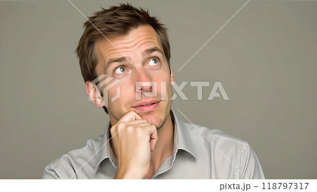 Thinking Pose Hand on chin eyes looking up 118797317