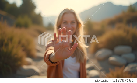 Waving toward the camera 118797560