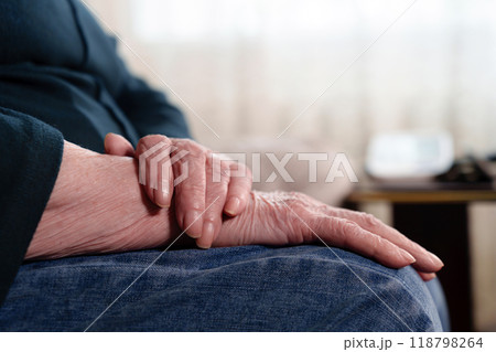 wrinkled hands of an elderly grandmother, elderly 118798264