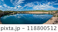 Serene Panoramic View of a Tranquil Blue Quarry Lake 118800512