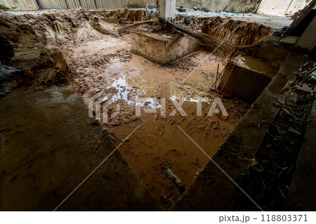 Large pile of earth in which there are many metal reinforcement bars Large pile of earth in which there are many metal reinforcement bars 118803371