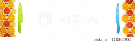 Flat layout banner with various fresh cut citrus fruits and one knife each on left and right side of image on a white background Flat layout banner with various fresh cut citrus fruits and one knife each on left and right side of image on a white background 118803956