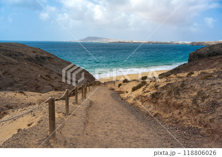 Beach access to one of the Papagayo beaches on the Canary Island of Lanzarote in the Atlantic Ocean 118806026