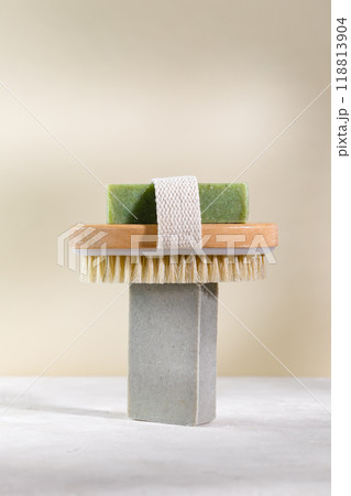 Minimalist still life with natural handmade soap and massage sponge 118813904