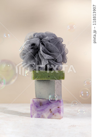 Minimalist still life with natural handmade soap and massage sponge 118813907