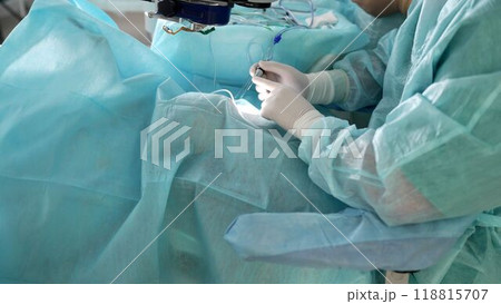 Two doctors in the operating room. Doctors in the operating room perform an operation, medium plan. Surgery department. 118815707